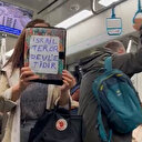 Marmaray'da bir kadın "İsrail terör devletidir" yazılı pankart hazırlayıp İsrail’i protesto etti