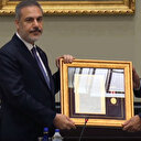 Erdoğan Hakan Fidan'a 'üstün hizmet madalyası' takdim etti