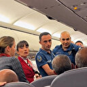 Tüm ısrarlara rağmen uçakta kemer takmak istemeyince tartışma çıktı