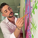 Çalıştığı hastanenin duvarlarını resimlerle süsleyen engelli temizlik görevlisi resim öğretmeni oldu