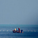 Les Philippines veulent le retrait de barrières flottantes d'un récif contesté