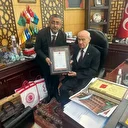Hizmete kazandırılan yeni teşkilat binasının tapusunu MHP lideri Bahçeli'ye takdim ettiler