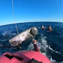 Ege'de akıntıya kapılarak açık denizde mahsur kalan baba ve kızını rüzgar sörfçüsü kurtardı