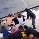 Botları su alan kaçak göçmenlerin kurtarılma anları kamerada