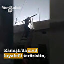 Kamışlı'da sivil kıyafetli teröristin, sivillere ait evin çatısından roketli saldırı anı kamerada