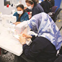 Maskeleri gönüllü personel dikiyor