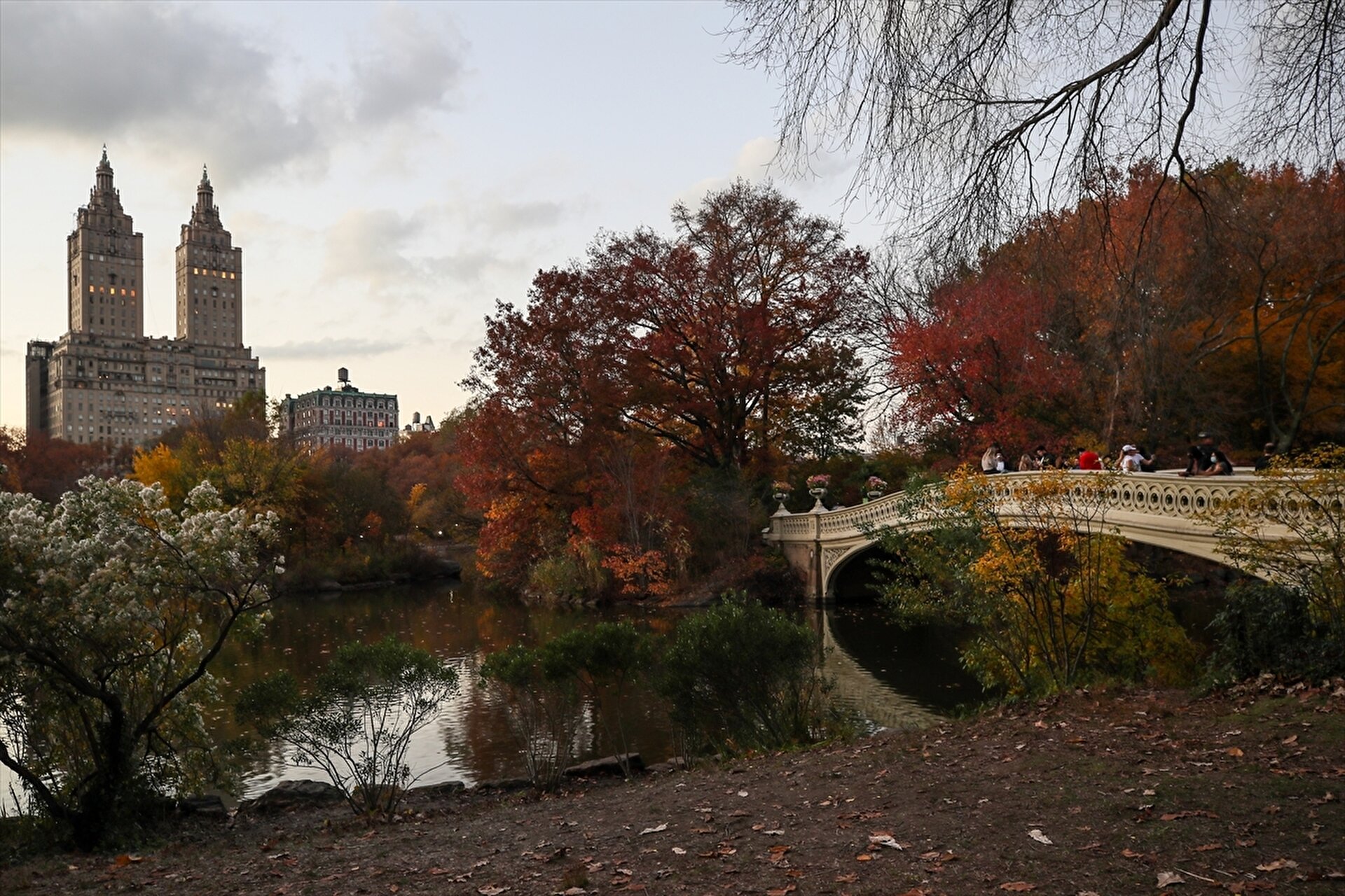 People enjoy autumn foliage at the Central Park in New York City