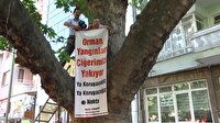 Basın açıklamasını ağacın üstüne çıkarak yaptı