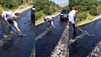 Eriyen asfalta yapışan yılanı vatandaş kurtardı