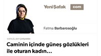 Caminin içinde güneş gözlükleri ile oturan kadın...