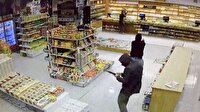 Film sahnelerini aratmayan silahlı soygun kamerada