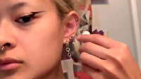 AirPods’larını kaybetmemek için küpeye çevirdi
