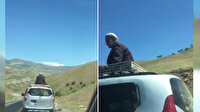 Aracın tavanında yolculuk eden dayı görenleri şaşkına çevirdi