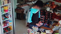 Markette telefon hırsızlığı kamerada