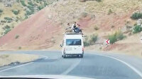 Minibüsün üstünde tehlikeli yolculuk