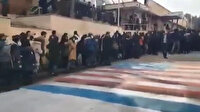 İran'da eylemciler ABD ve İsrail bayraklarına basmadan etrafından dolaştı