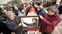 Eşinin yanına konuldu