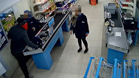 Market çalışanlarını gasbeden şüpheli güvenlik kamerasında
