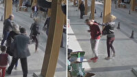 Telefonla konuşan adama tokat atıp kürekle saldıran kadın kamerada