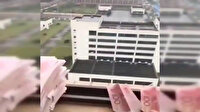Umutsuz Vuhanlılar paralarını uçak yapıp camdan uçuruyor