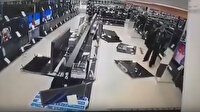 Putin'e sinirlenip çekiçle mağazadaki televizyonları kırdı