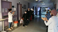 Koronavirüs hastası dede ve torun alkışlarla taburcu oldu