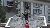 Üç gencin apartman çatısında yaptığı tehlikeli gösteri yürekleri ağza getirdi