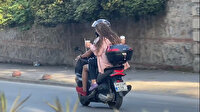 Elinde kahve bardaklarıyla motosiklet yolculuğu kamerada