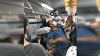 Metrobüste tavandan akan sudan dolayı şemsiyeyle yolculuk ettiler