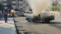Yanan otomobile bahçe hortumuyla müdahale etti