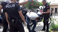 Yürüyemediği gerekçesiyle otomobilden inmeyen dilenciyi polis böyle yürüttü