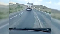 Ambulansa yol vermek yerine 130 kilometre hızla yarışa giren kamyon sürücüsü kamerada