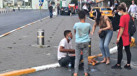 Taksim Meydanı'nda simit tepsisiyle bir anda kendini yere bırakıp insanlardan para topladı