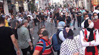 İstiklal Caddesi'nde itfaiye çalışmasını izleyen vatandaşlar sosyal mesafeyi unuttu