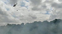 Ümraniye'de otluk alandaki yangına helikopterle müdahale edildi