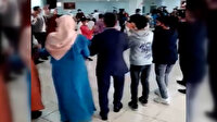 Koronavirüsü hiçe saydılar: Kapalı salonda kol kola halay çektiler