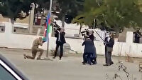 İlham Aliyev işgalden kurtarılan bölgede Azerbaycan bayrağını öperek göndere çekti