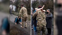 Azerbaycanlı anne, Karabağ'a yolladığı oğlunu ayaklarına kapanarak karşıladı