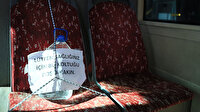 Otobüsteki koltuklara 5 litrelik plastik su ile önlem