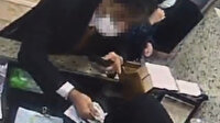 Tırnakçılık yöntemiyle 3 bin dolar çalan İranlı güvenlik kamerasında