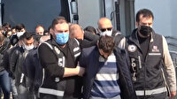 Adana'da silah kaçakçılığından gözaltına alınan 20 zanlı adliyeye sevk edildi