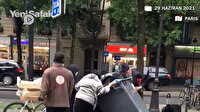 Paris'te ihtiyaç sahiplerinin çöp konteynerinden gıda toplama mücadelesi kamerada