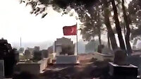 Alevler içinde kalan mezarlıkta şehit kabri ve Türk bayrağı yanmadı