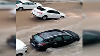 Ankara'da yağmur sele döndü: Rögara takılan otomobil havada asılı kaldı