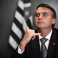 Koronavirüs testi pozitif çıkan Bolsonaro herkesin önünde maskesini çıkardı