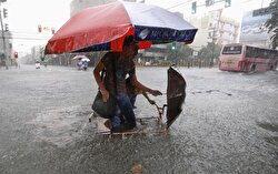 A commuter is transported on a partially submerged pedicab along a flooded road as tropical storm Fung-Wong battered the Philippine capital Manila September 19, 2014.  Heavy rain in the Philippine capital, Manila, caused flooding in many areas on Friday, shutting schools, government offices and financial markets as a tropical storm made landfall to the north. Thousands of residents in low-lying areas were moved to higher ground, officials said, as flood waters rose quickly after the equivalent of half a month's usual rain fell in six hours. REUTERSErik De Castro (PHILIPPINES - Tags DISASTER ENVIRONMENT)