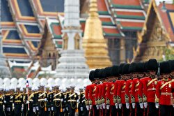 Royal Guards take part in the royal cremation procession of late King Bhumibol Adulyadej in front of the the Grand Palace in Bangkok, Thailand.