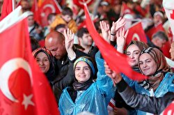 Supporters of AK party react at the party headquarters in Ankara, Turkey, April 16, 2017. 