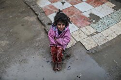 A Palestinian barefoot kid from Abu Shavis family looks on as she tries to live in hard conditions with his family on a cold day in Zeitoun district of Gaza City, Gaza on January 05, 2018.