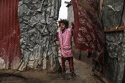 A Palestinian barefoot kid from Abu Shavis family walks around as she tries to live in hard conditions with his family on a cold day in Zeitoun district of Gaza City, Gaza on January 05, 2018.